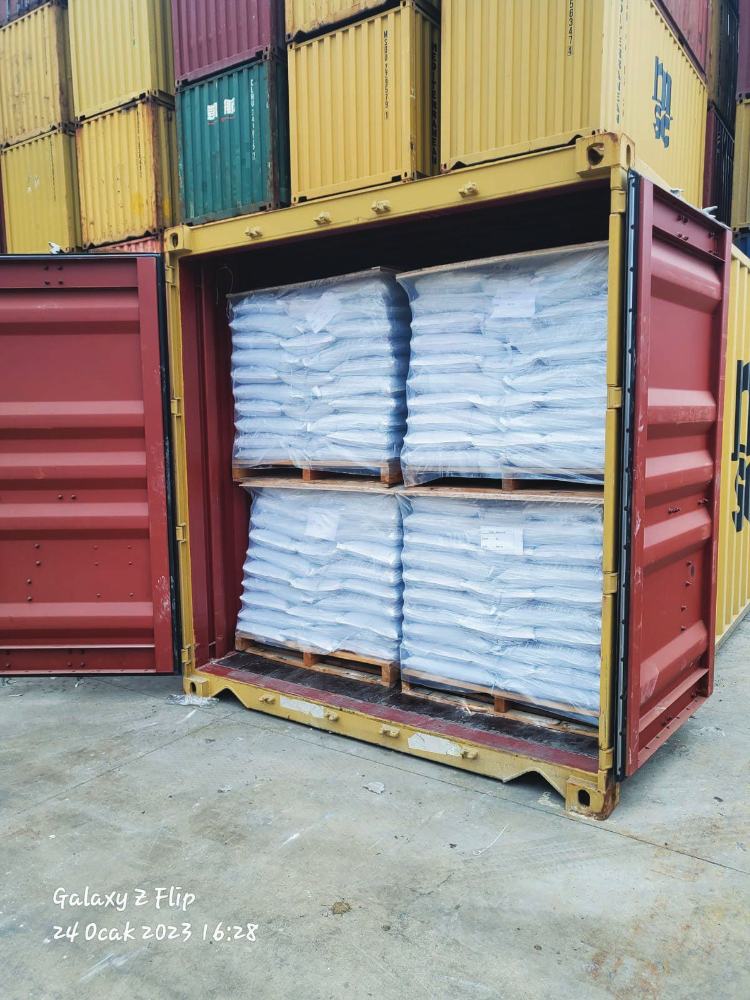 Container loaded with palletised FIBC bags